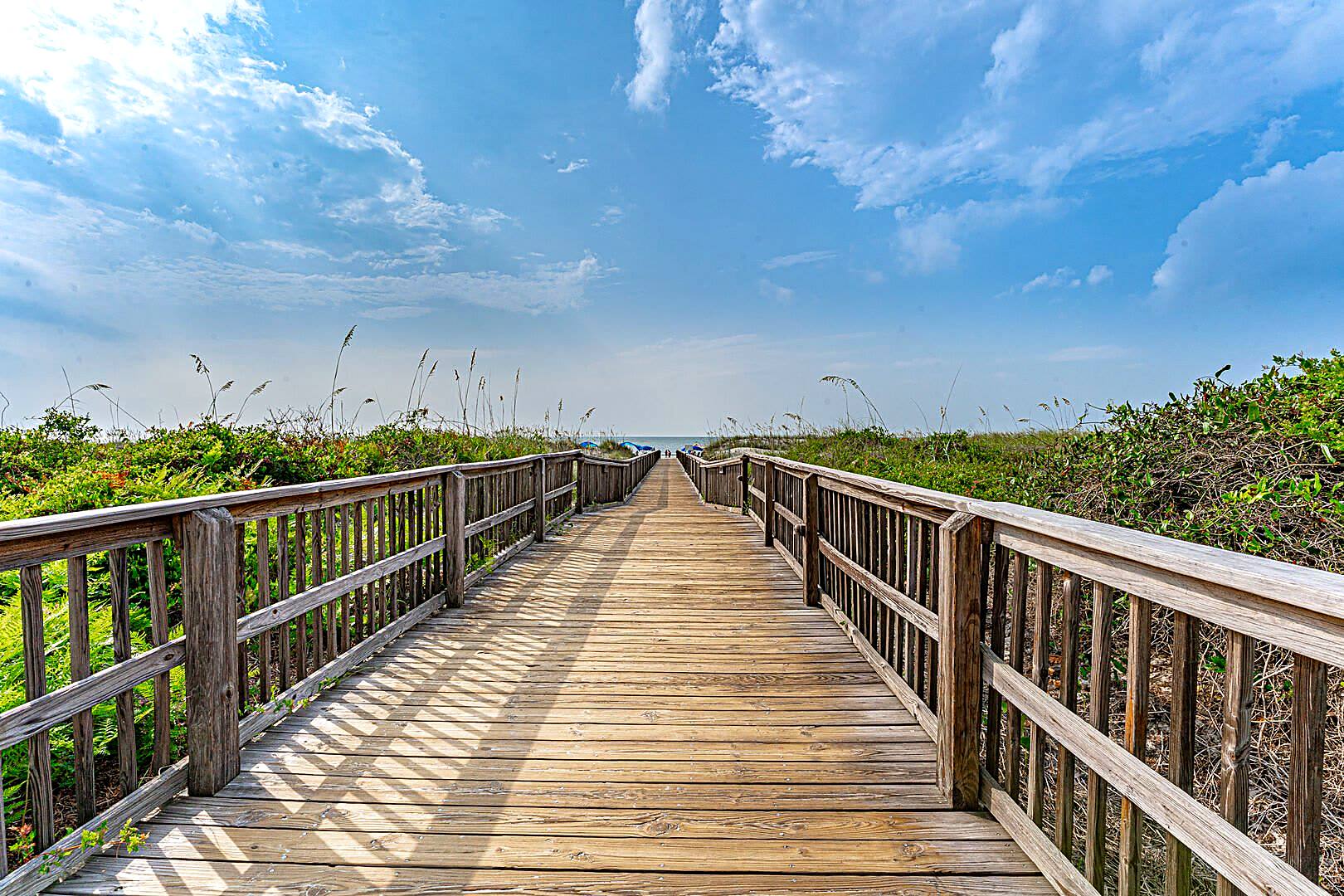 Wooden boardwalk crossing the dunes at Folly Field Beach Park, three blocks from 122 Sandcastle Court on Hilton Head Island